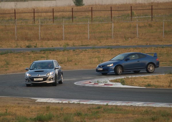 JDM DC5 Integra TypeR chasing a Mazda at the track