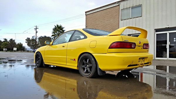 2000 Phoenix Yellow Acura Integra Type-R in puddle