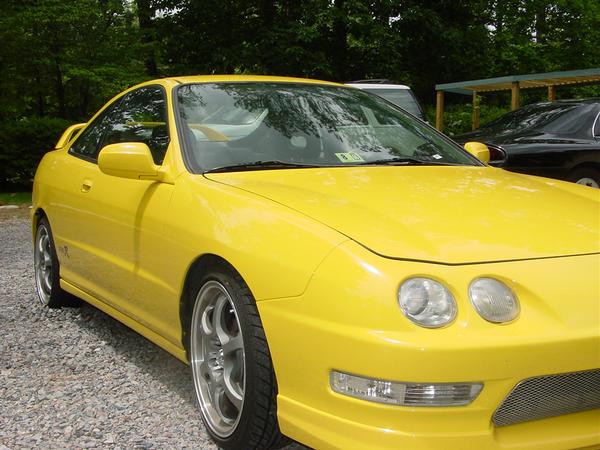 Phoenix yellow itr with clear corners, aftermarket wheels, and grill