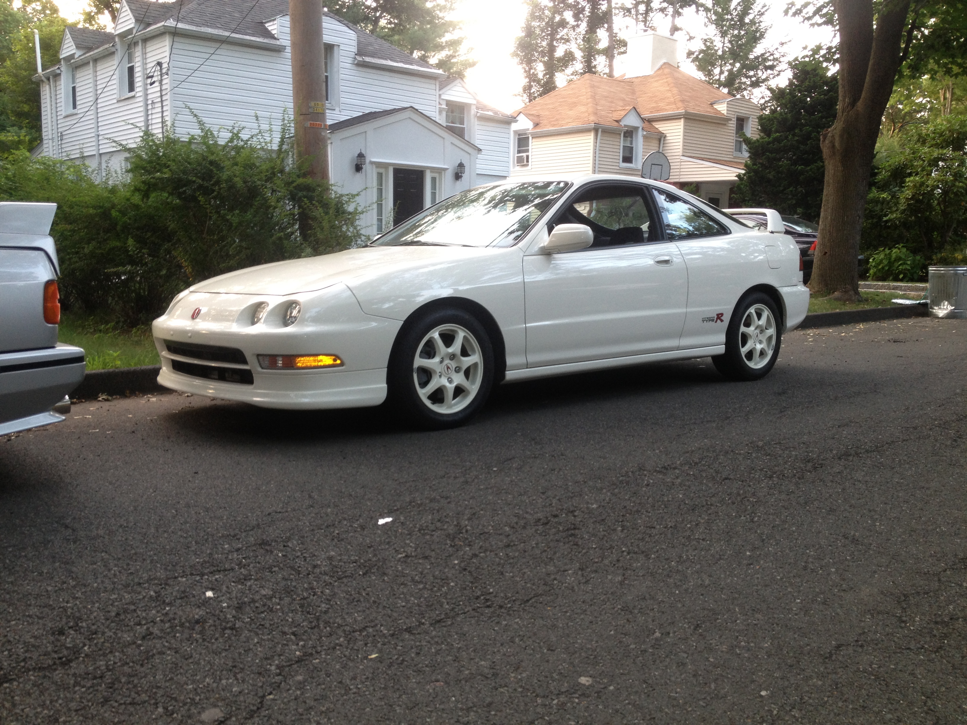 championship white 1997 Acura Integra Type-R parked on the sidewalk