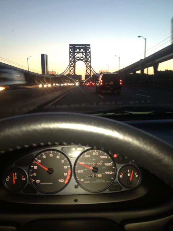 1997 Acura Integra Type-R driving across a bridge	