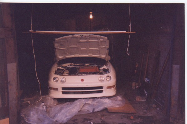 championship white 1997 Acura Integra Type-R in garage