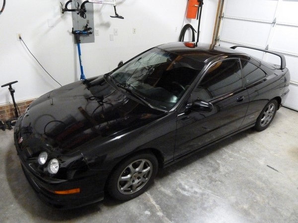 Black Integra Type-R sitting safely in a garage
