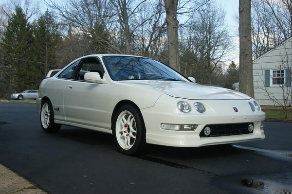 1998 championship white Acura Integra Type-R with aftermarket wheels