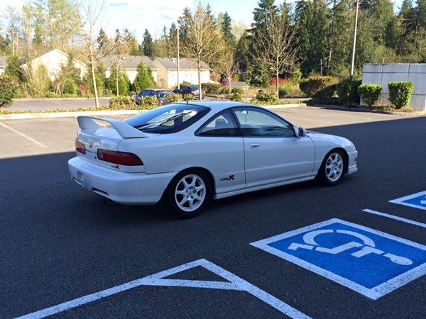 1998 Championship White Acura ITR passenger side